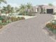 A curved gray paver driveway leads to a Florida home among palms and flowers.