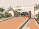 Pickup truck parked inside a paved gate entrance with palms and drainage channels.