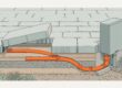 A lifted patio paver reveals an orange-marked conduit beside an accessible outdoor electrical box.