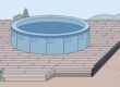 A round hot tub rests on pavers above a compacted base, with the patio sloping away.