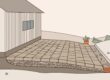 Patio pavers slope away from a house toward a drainage channel.