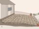 Patio pavers slope away from a house toward a drainage channel.