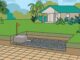 A paver patio stops before a grassy septic field marked by an orange stake.